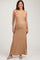 woman wearing a tan ribbed maternity maxi dress with adjustable straps and a visible baby bump