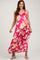 woman wearing a fuchsia floral print maxi dress with ruffled straps in maternity wear