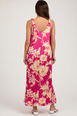 woman wearing a pink floral maternity maxi dress with ruffled straps and a relaxed fit, showcasing a baby bump