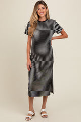 woman wearing a black and white striped maternity dress with short sleeves and a side slit, revealing her baby bump