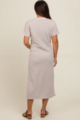 woman wearing a striped maternity maxi dress with short sleeves and a relaxed fit, showing a baby bump