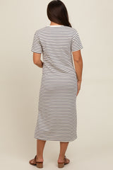 woman wearing a striped maternity maxi dress with short sleeves, seen from the back