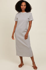 woman wearing a white and black striped t-shirt midi dress with short sleeves and side slits