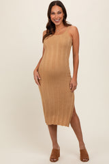 woman wearing a tan ribbed maternity dress with a side slit and a visible baby bump