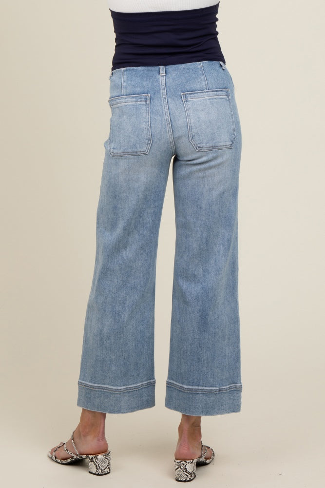 maternity wear light blue wide-leg jeans with cuffed hem, shown from the back with no visible baby bump