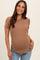 woman wearing a tan short sleeve maternity t-shirt and showing her baby bump