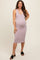 woman wearing a light lavender ribbed maternity dress with a fitted silhouette and baby bump visible