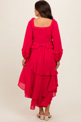 maternity wear in vibrant pink with ruffled layers and long sleeves, model shown from the back