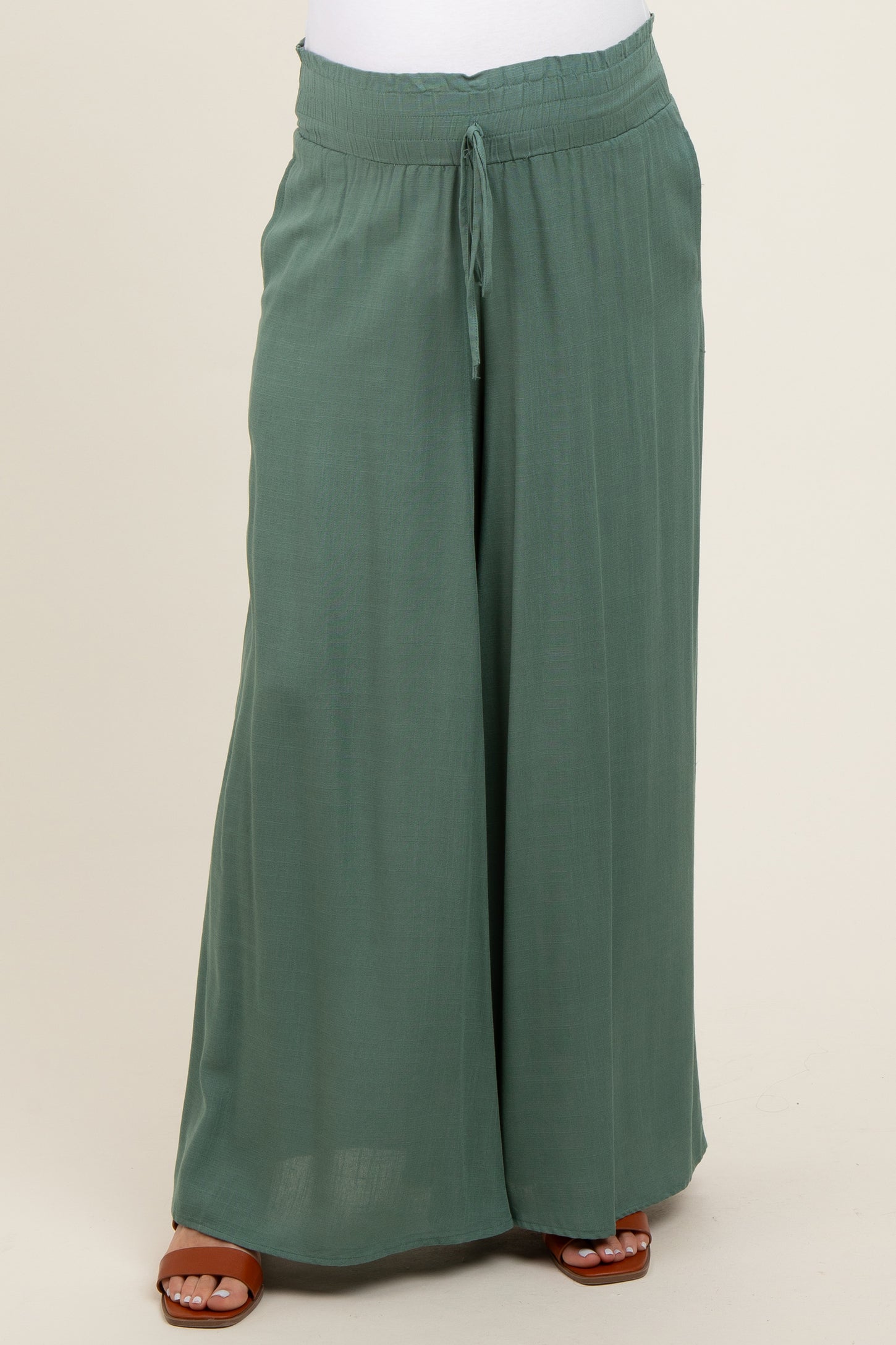 maternity wear in a light green wide leg pant with an elastic waistband and drawstring, model not visible