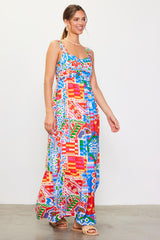 woman wearing a colorful patterned maxi dress with adjustable straps and a fitted bodice