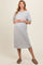 woman wearing a gray short sleeve maternity dress, showcasing her baby bump