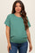 woman wearing a green short sleeve maternity top with a loose fit and a visible baby bump