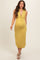 woman wearing a mustard yellow maternity dress with a deep v-neck and twist front detail, showing her baby bump
