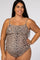woman wearing a leopard print maternity swimsuit with adjustable straps and a visible baby bump