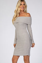 woman wearing a light grey off-the-shoulder ribbed bodycon dress with long sleeves