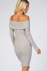 woman wearing a light grey off-the-shoulder ribbed dress with long sleeves