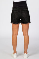 woman wearing black maternity denim shorts with a frayed hem and a supportive waistband