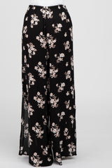black wide leg pants with white floral print and side slits on a white background