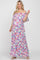 Pregnant woman wearing a floral off-the-shoulder maternity maxi dress with pink and blue flowers
