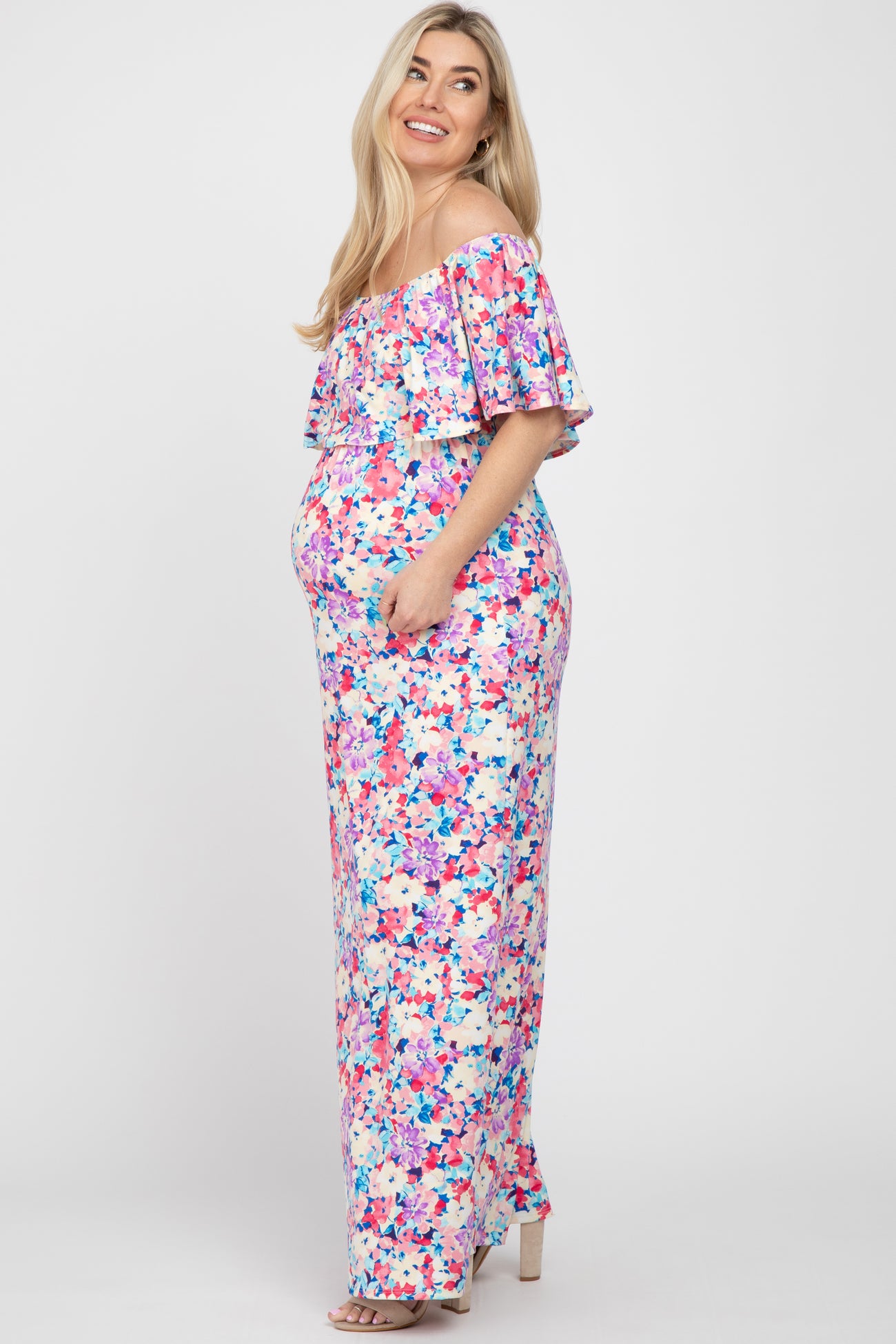 pregnant woman in floral off-the-shoulder maternity maxi dress with ruffle detail