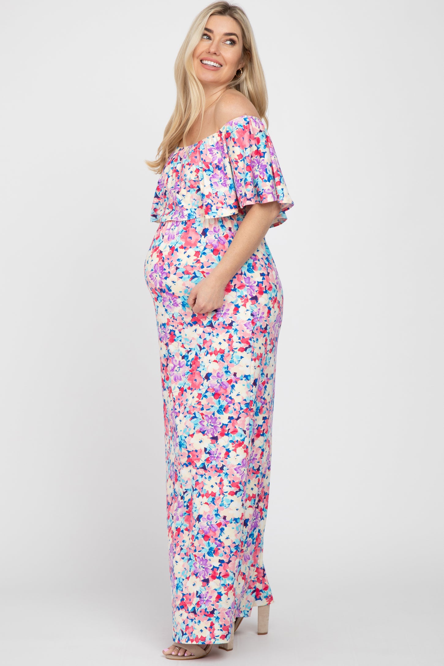 pregnant woman in floral off-the-shoulder maternity maxi dress with ruffle detail