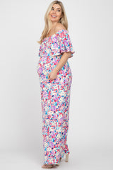 pregnant woman in floral off-the-shoulder maternity maxi dress with ruffle detail