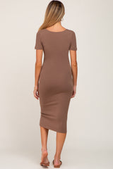 Back view of a woman wearing a short sleeve brown midi bodycon dress