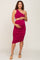 pregnant woman in magenta one-shoulder maternity dress with side cutout and ruched skirt