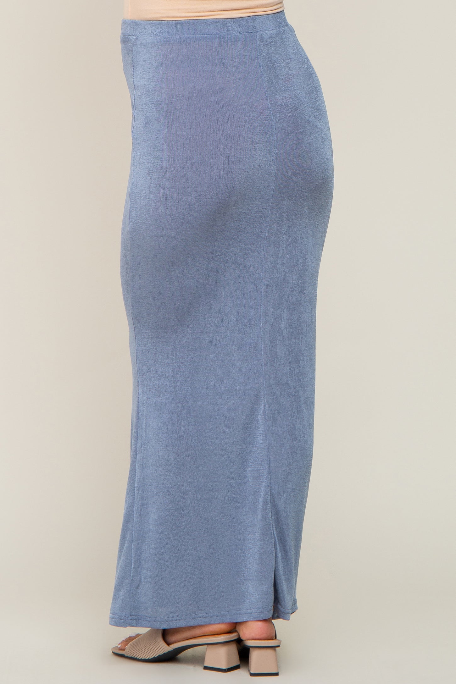 light blue textured maxi skirt worn with beige block heel sandals