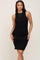 woman wearing a sleeveless black ribbed bodycon dress with a high neckline and gold necklace