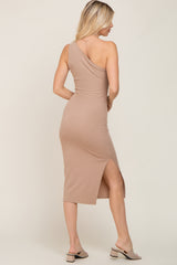 Woman wearing a tan ribbed one-shoulder midi dress with a side slit and matching block heel sandals