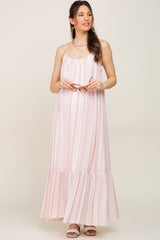 pregnant woman in pink and white striped maternity maxi dress holding sunglasses