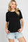 woman wearing a black short sleeve crew neck t-shirt and light wash denim shorts