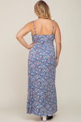 Back view of a woman wearing a blue floral maxi dress with spaghetti straps and a smocked back