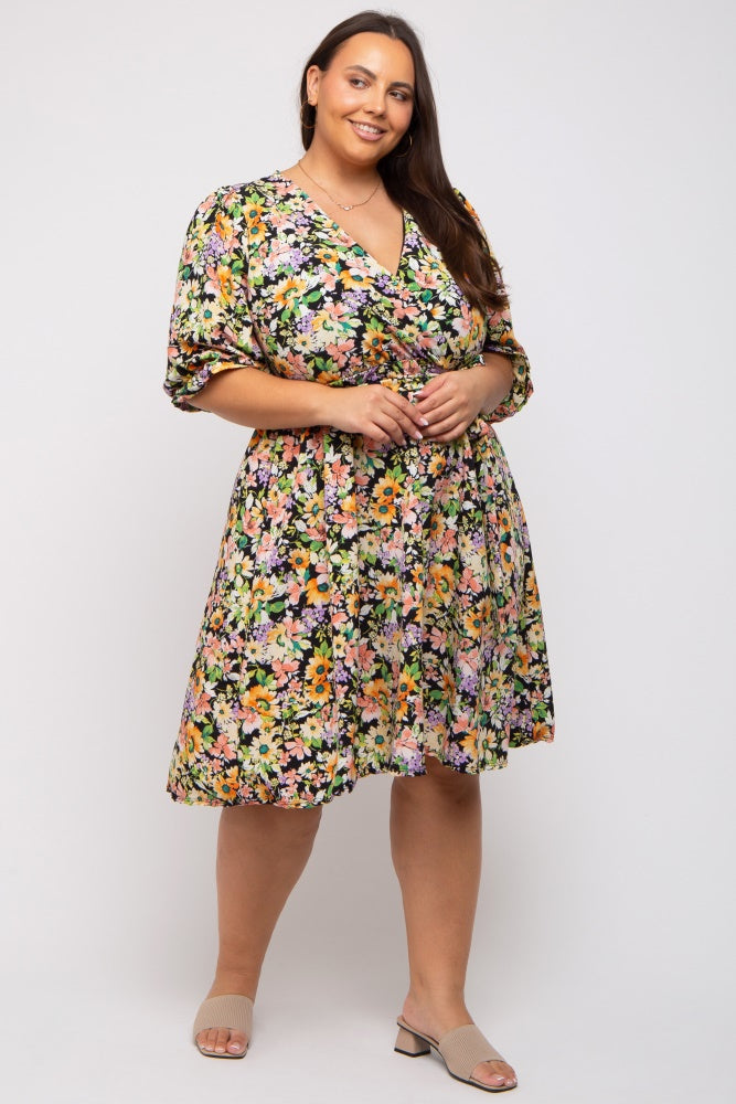 plus size woman wearing a short sleeve floral wrap dress with a v-neckline and tan block heel sandals