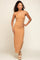 woman wearing a tan ribbed maxi dress with spaghetti straps and posing with one hand on her hip