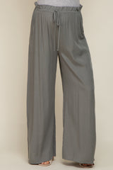 woman wearing grey wide leg pants with drawstring elastic waistband and textured fabric