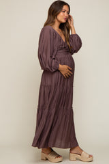 pregnant woman in a mauve long sleeve tiered maternity maxi dress and platform sandals