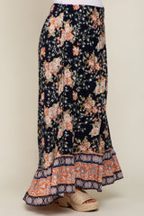 navy blue floral maxi skirt with smocked waist and ruffled hem paired with woven platform sandals