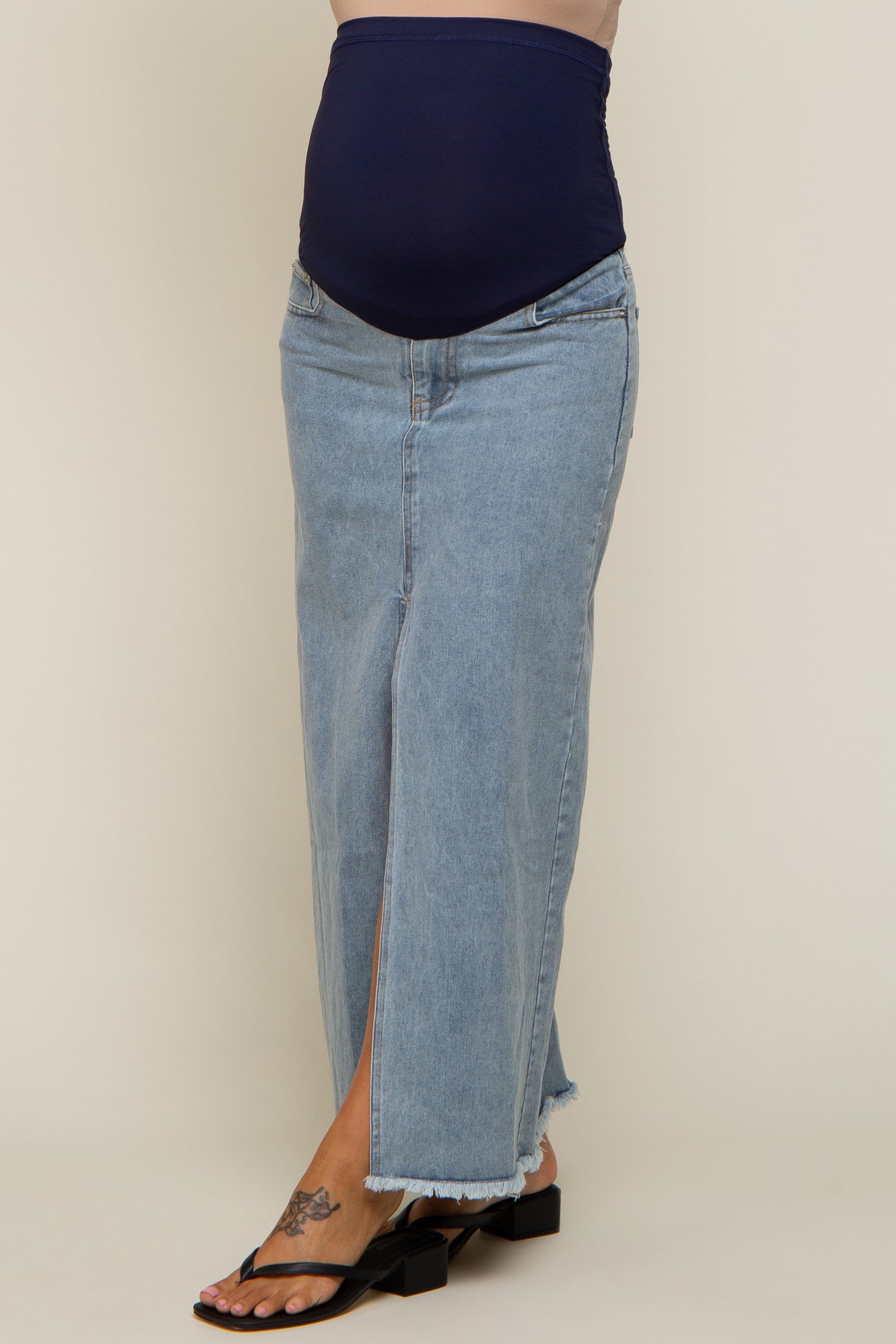 maternity light wash denim maxi skirt with navy blue belly band and frayed hem