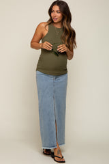 pregnant woman wearing olive green ribbed tank top and long denim maxi skirt with front slit