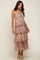 woman wearing a tiered floral midi dress with lace-up bodice and woven platform sandals