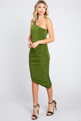 woman wearing a green one-shoulder fitted midi dress with ruching detail and strappy black heels